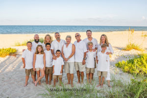 Family gathers on the beach during family photos in Vero Beach Florida