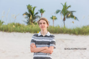 Close up of oldest grand kid looking out on the beach during family photo shoot in Vero Beach Florida