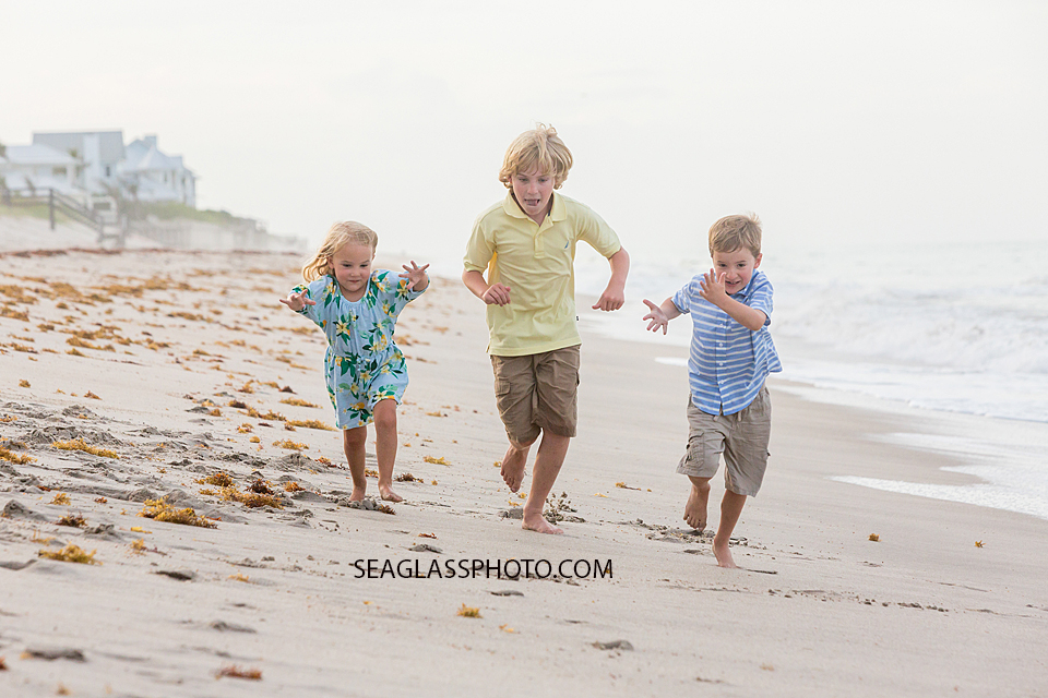 Siblings race to the finish line during family photo shoot in Vero Beach Florida