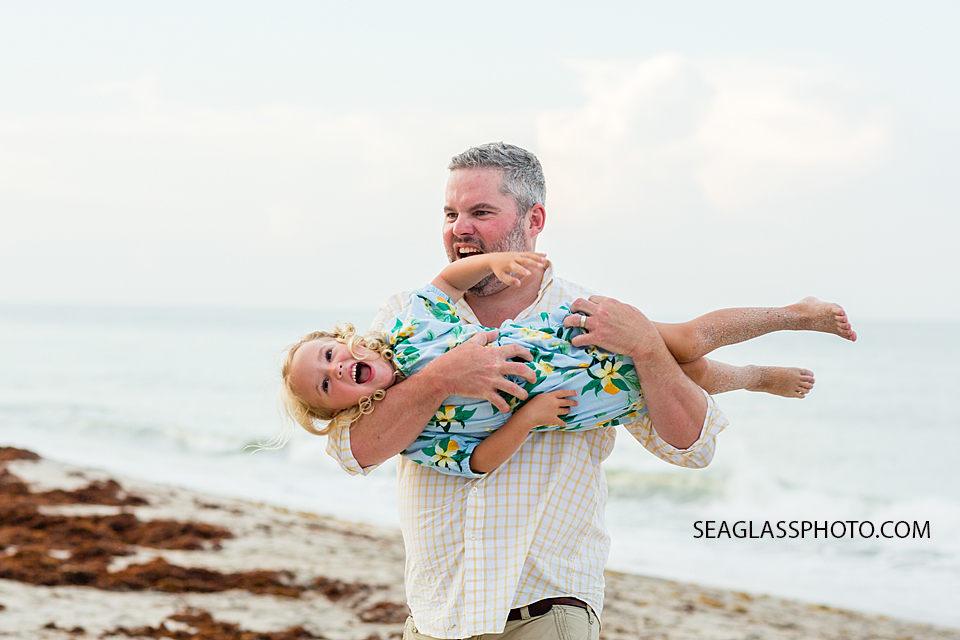 Father messes with his daughter during family photo shoot in Vero Beach Florida