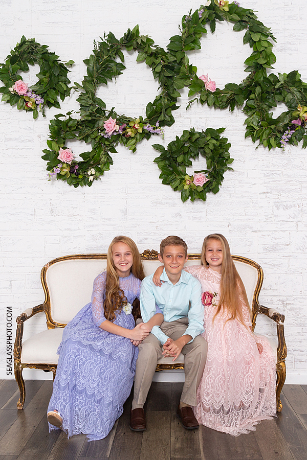 Siblings get close for a picture during family photos in Vero Beach Florida