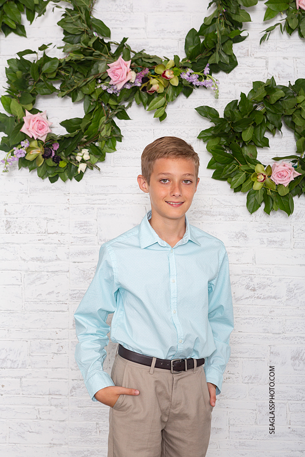 Close up of a young boy smiling for the camera during family photos in Vero Beach Florida