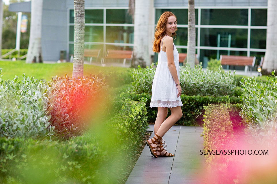 Young senior walks toward her future during senior photos in Vero Beach Florida