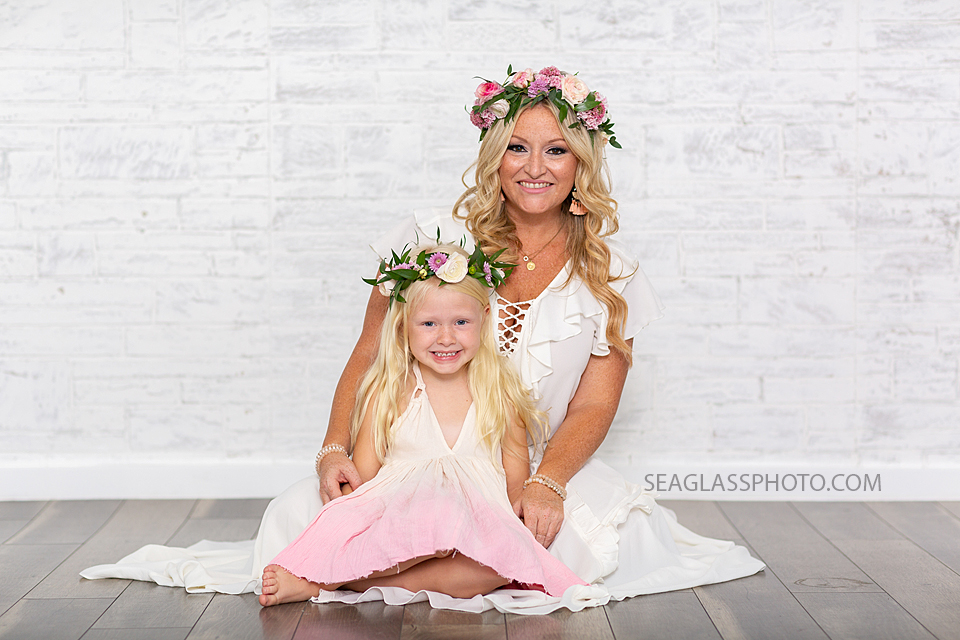 Mom and daughter sit during mom and daughter photo shoot in Vero Beach Florida