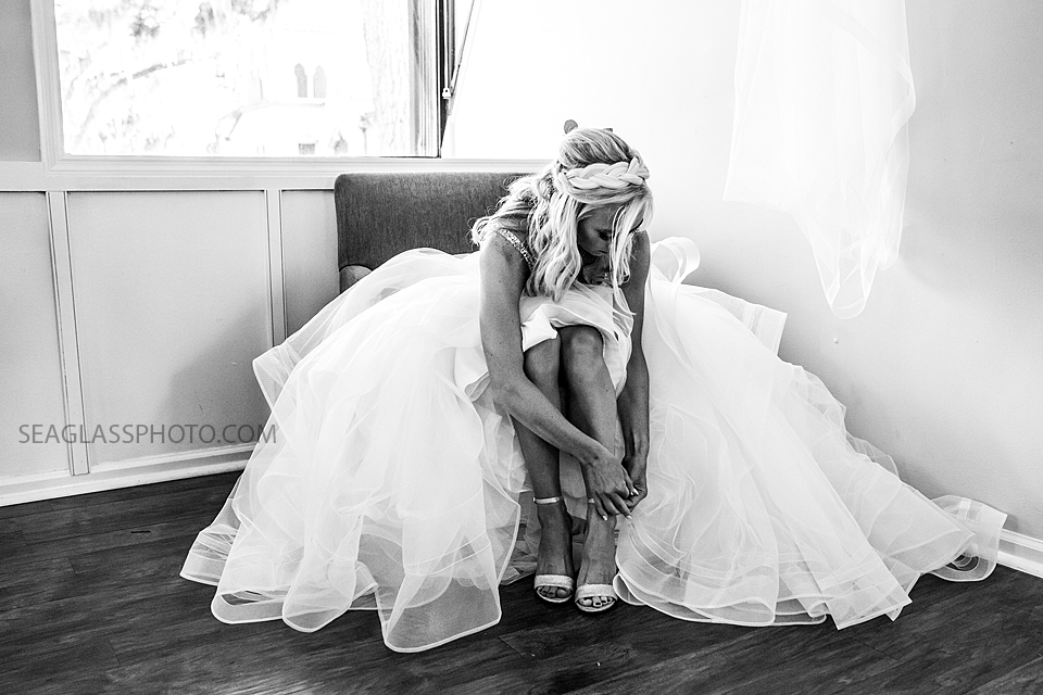 Black and white photo of the bride getting ready before her wedding Photographed by a Vero Beach Photographer