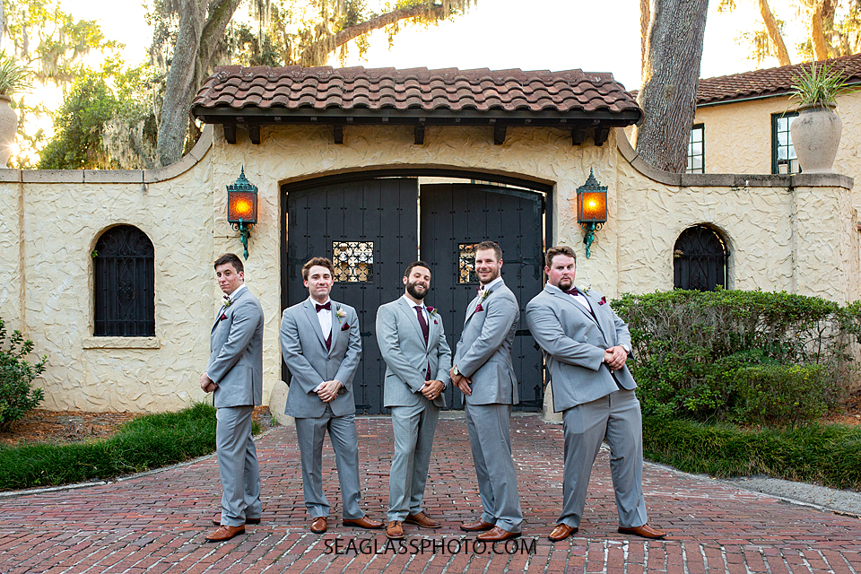 Groom and groomsmen pose for a picture photographed by a Vero Beach Photographer