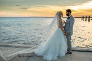 Husband and Wife hold hands overlooking the Bay photographed by a Vero Beach Photographer