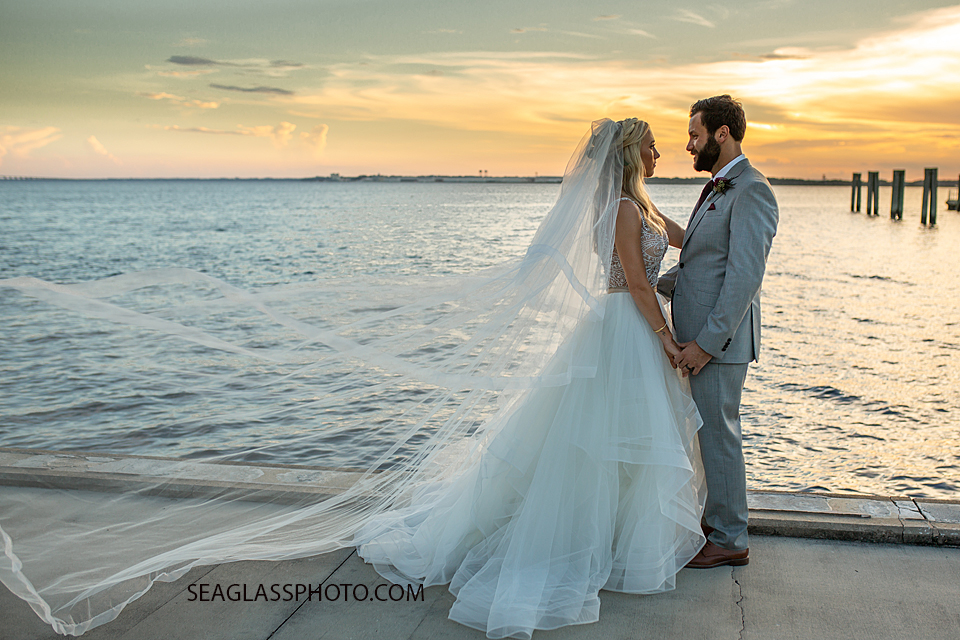 Husband and Wife hold hands overlooking the Bay photographed by a Vero Beach Photographer