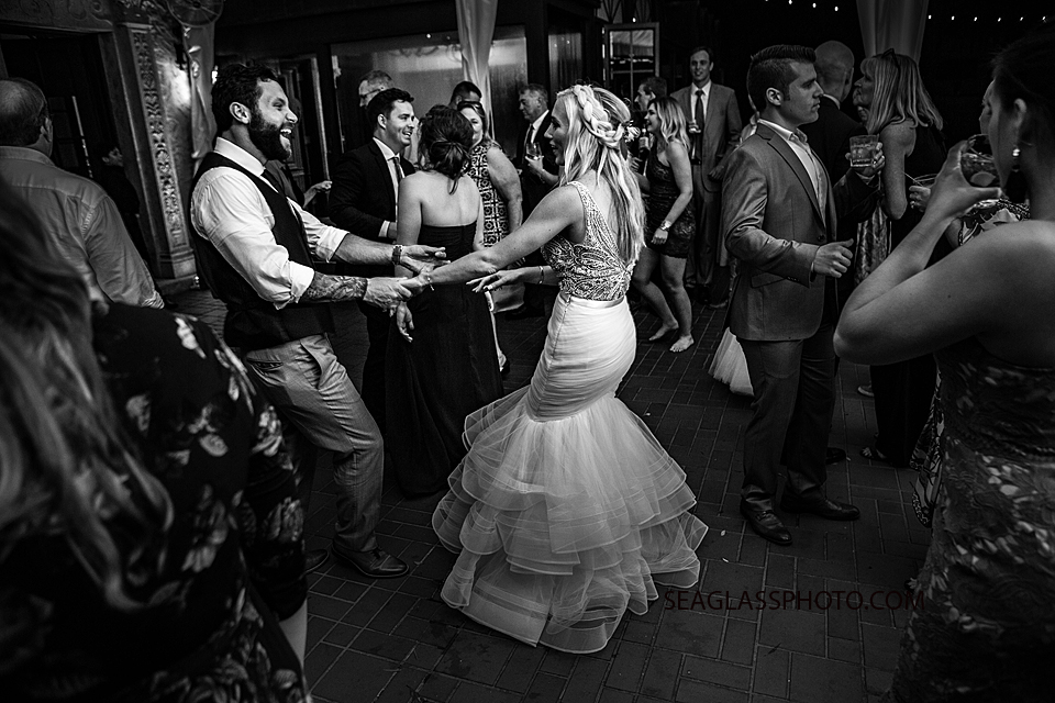 Black and white photo of the bride and groom dancing together photographed by a Vero Beach Photographer