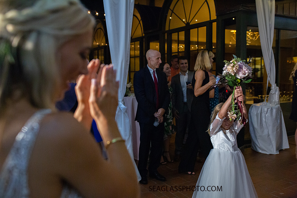 The flower girl caught the bouquet photographed by a Vero Beach Photographer