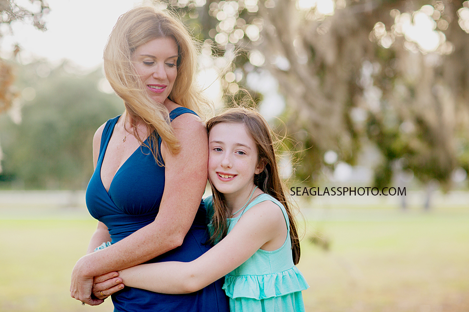 Daughter hugs her mother while at Riverside Park in Vero Beach Florida