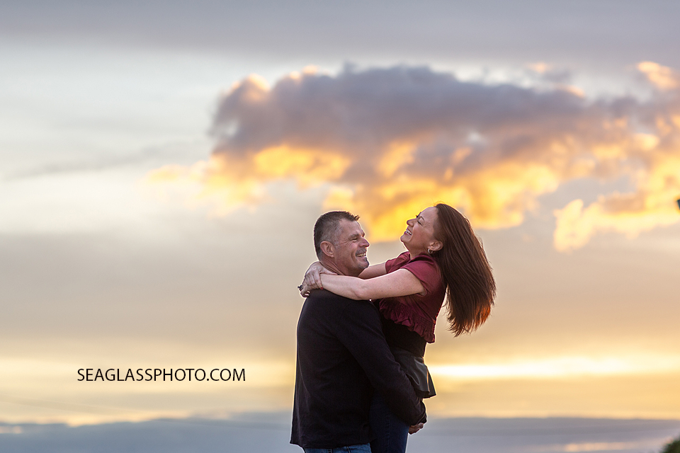 Husband and wife mess around during family photos in Vero Beach Florida