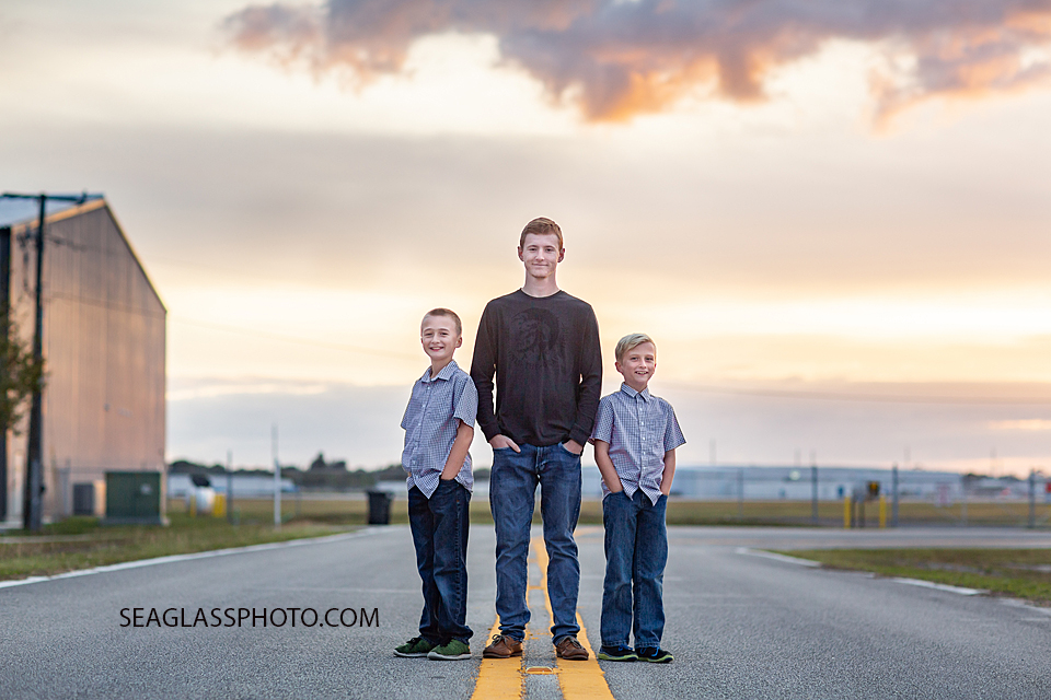 Three brothers pose on the street during family photos in Vero Beach Florida