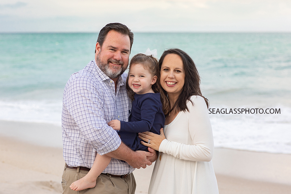 Close up of family on the beach during family photos in Vero Beach Florida