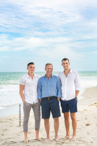 Father and sons on the beach during family photos in Vero Beach Florida
