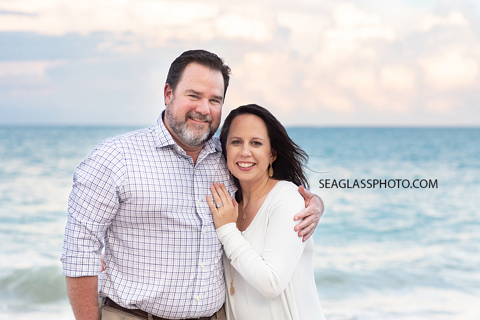 Close up of husband and wife in front of the ocean during family photos in Vero Beach Florida
