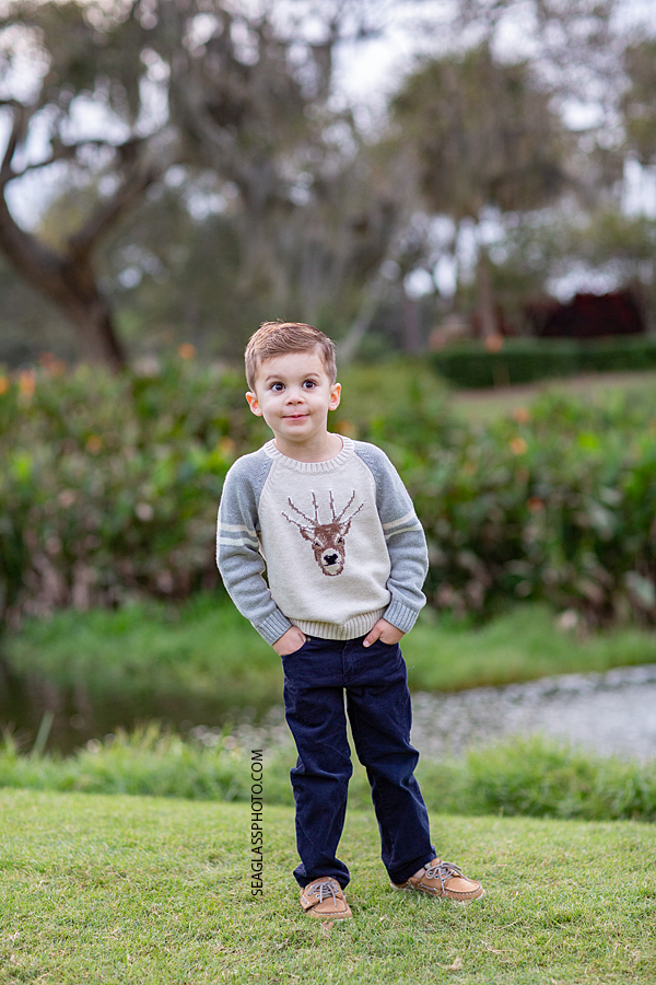 Young boy making silly faces during family photos at the Country Club in Vero Beach Florida