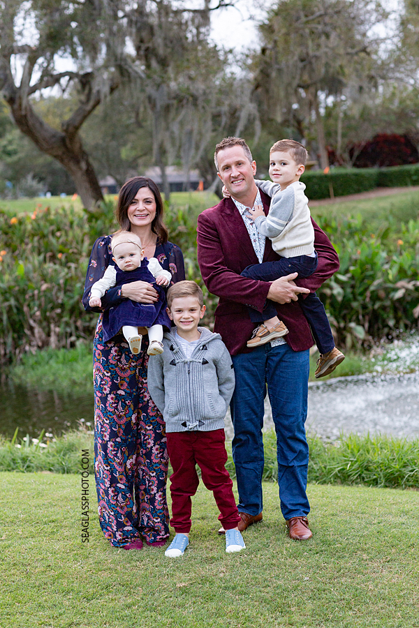 Family of five poses for a picture during family photos at the Country Club in Vero Beach Florida