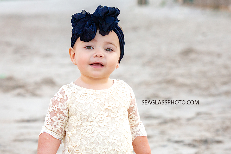 Close up of little girl smiling at the camera during their family photoshoot in Vero Beach Florida