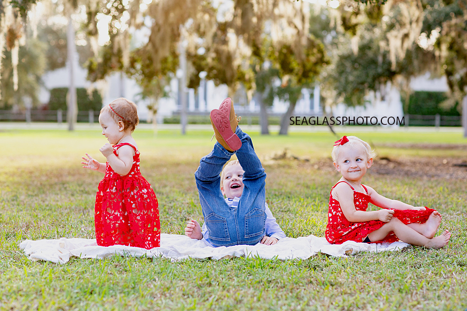 Siblings messing around during family photos at Riverside in Vero Beach Florida