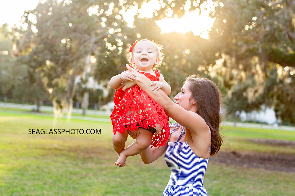 Mother plays with her daughter during family photos at Riverside in Vero Beach Florida