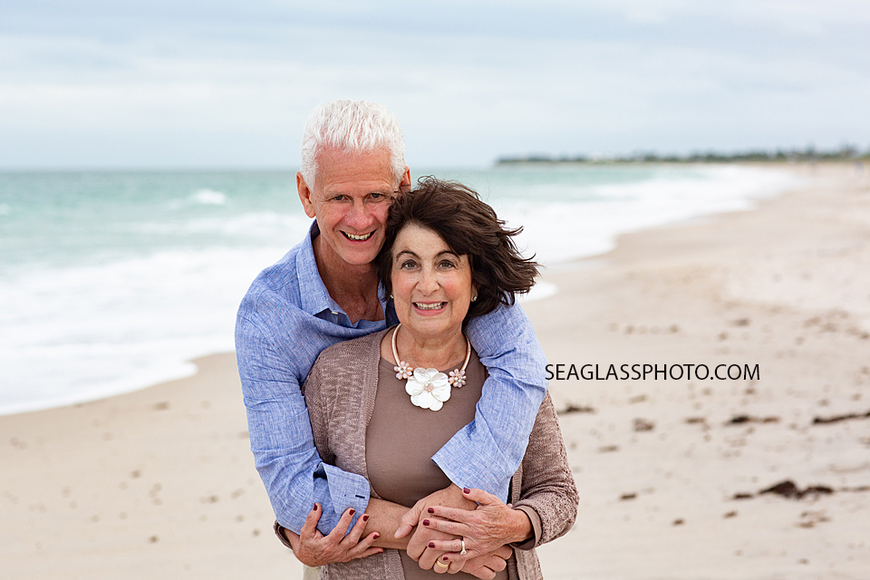 Close up of husband and wife on the beach during family photos in Vero Beach Florida