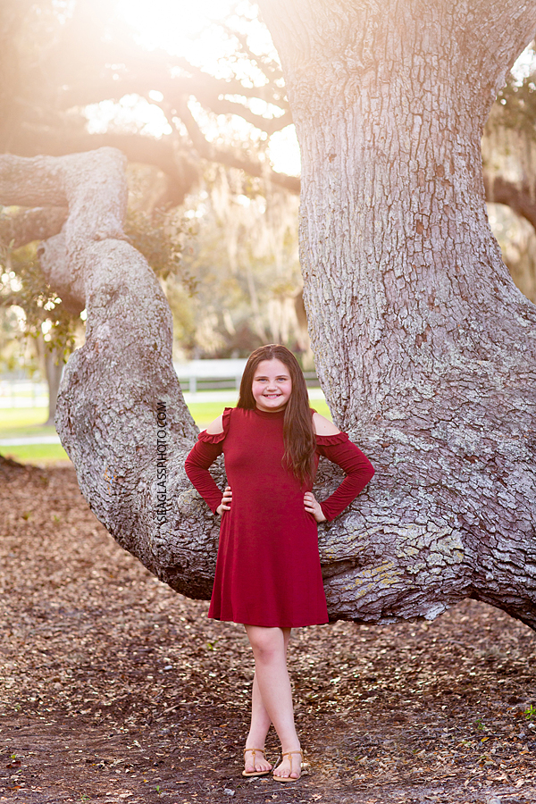 Young girl poses for the camera during sister photoshoot in Vero Beach Florida