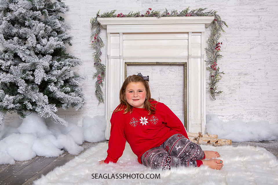 Young girl poses for the camera during holiday family photos in Vero Beach Florida