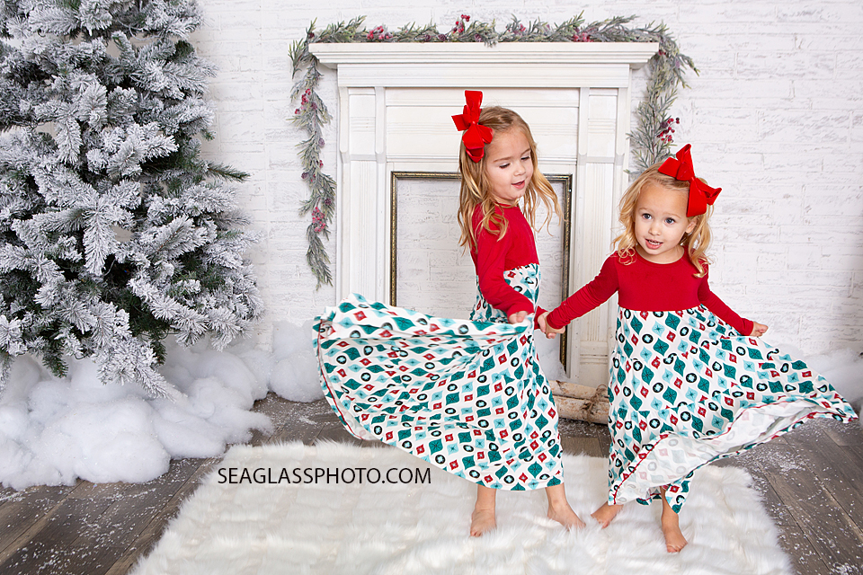 Close up of sisters dancing during Christmas photos in Vero Beach florida