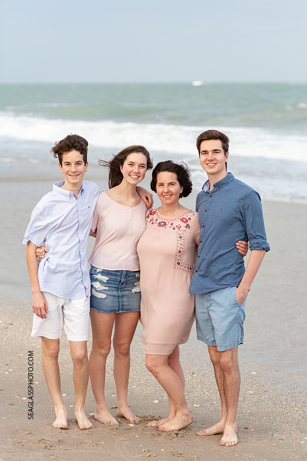 Kids smile with their mom during family photoshoot on the beach in Vero Beach Florida