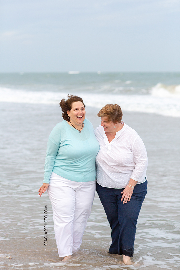 Close up of two ladies walking and laughing during family photoshoot on the beach in Vero Beach Florida
