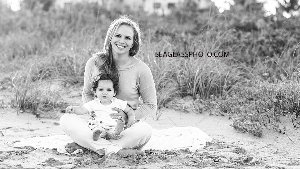 Black and white photo of a mom and her youngest daughter during their family photo shoot in Vero Beach Florida