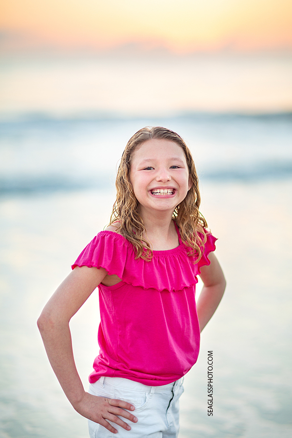 Young girl can't stop smiling for the camera during a family photoshoot in Vero Beach Florida
