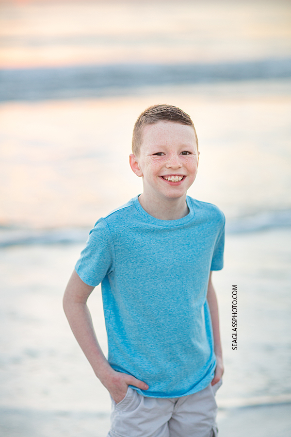 Young boy smiles for the camera during a family photoshoot in Vero Beach Florida