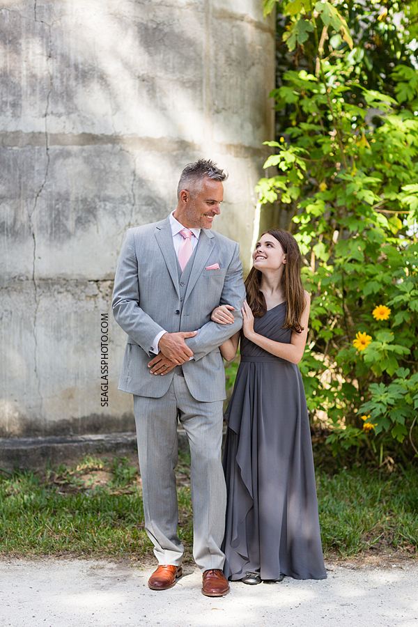 Groom and his daughter smiling at each other after the wedding in Vero Beach Florida