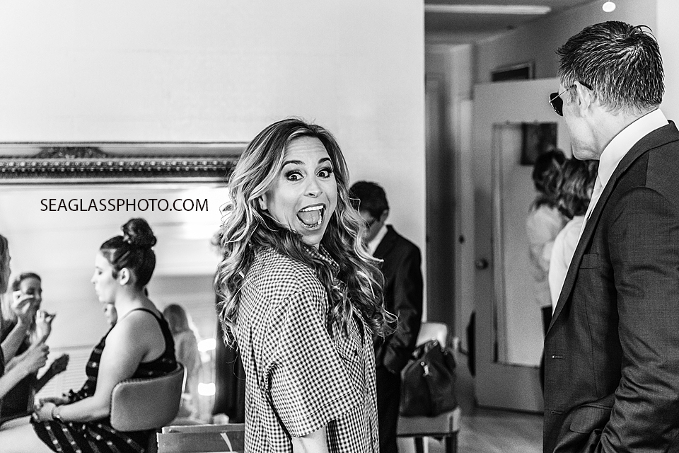 Bride smiles in excitement as she gets ready for her wedding in Vero Beach Florida
