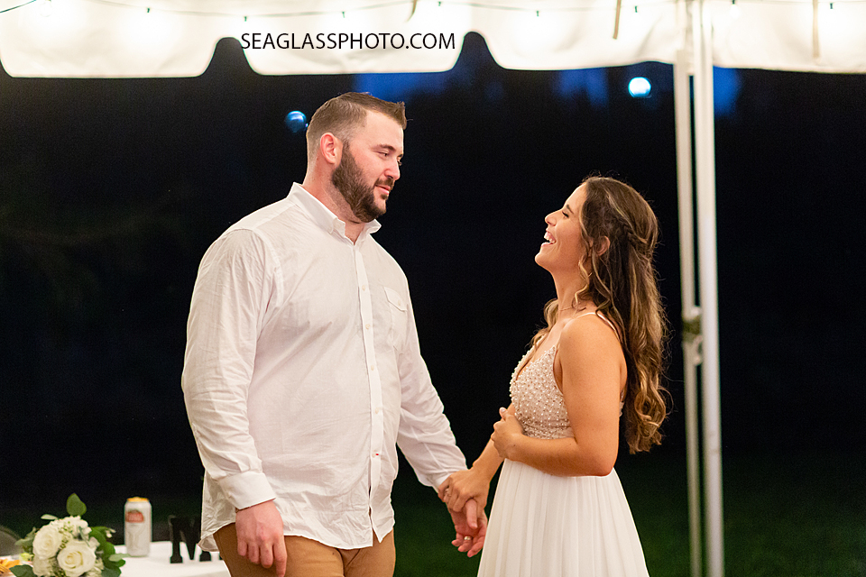 Bride and groom standing together on the dance floor at their wedding in Vero Beach Florida