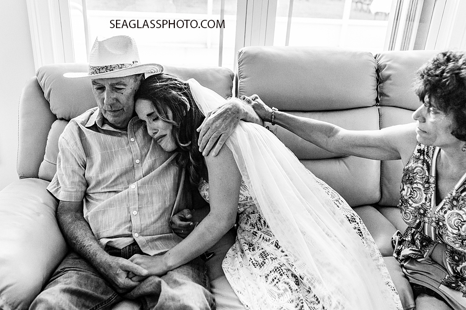 Black and White bride and Father holding each other before her wedding in Vero Beach Florida