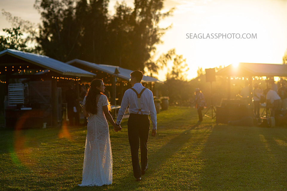 Bride and Groom walk to their reception area in Vero Beach Florida