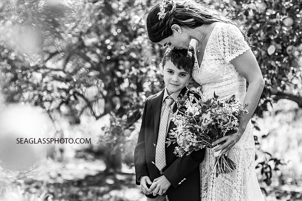 Black and white photo of the Bride kissing her son on the head in Vero Beach Florida