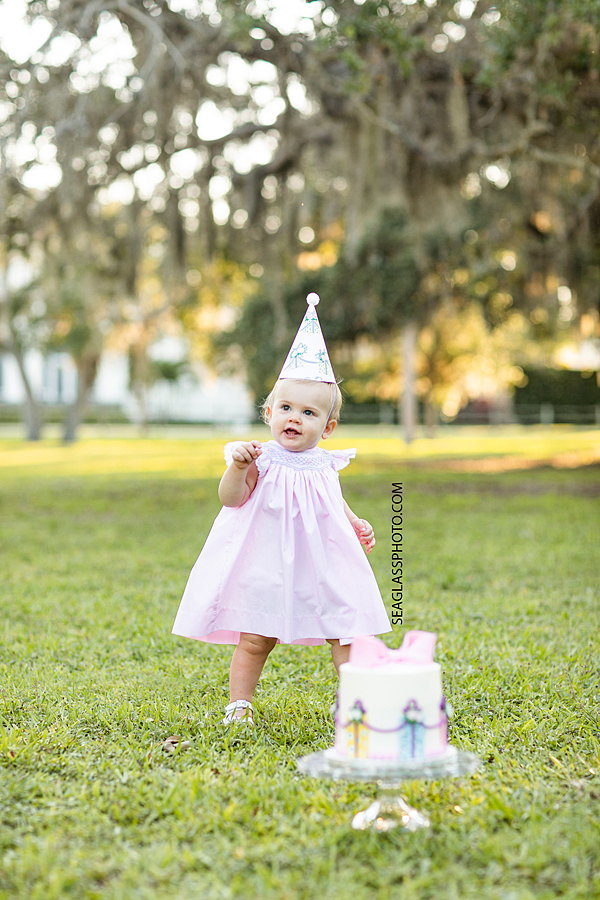 Adorable girl with her birthday cake in Riverside Park in Vero Beach Florida