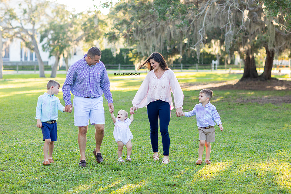 Happy Family Walking Together in Riverside Park in Vero Beach Florida