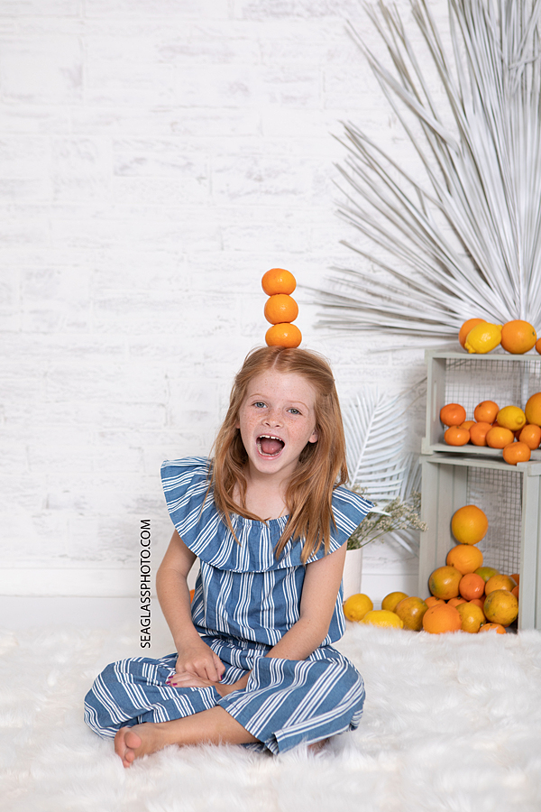 Cute Redhead Girl Playing with Oranges in Vero Beach Florida