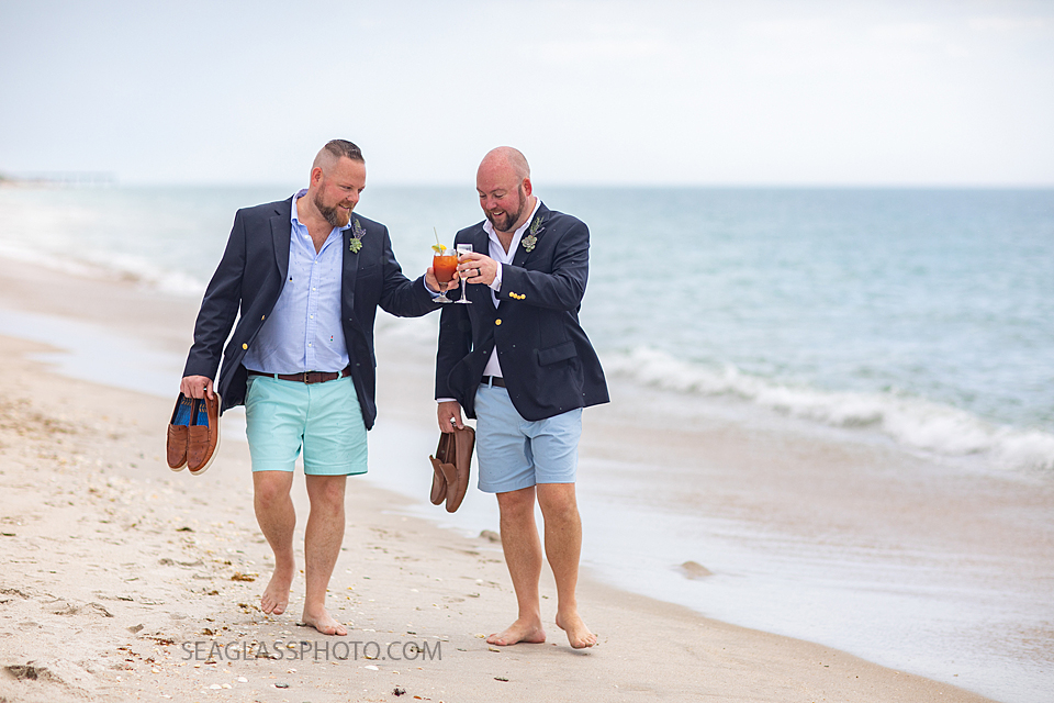 LGBT Grooms having a cocktail on the beach in Vero Beach Florida