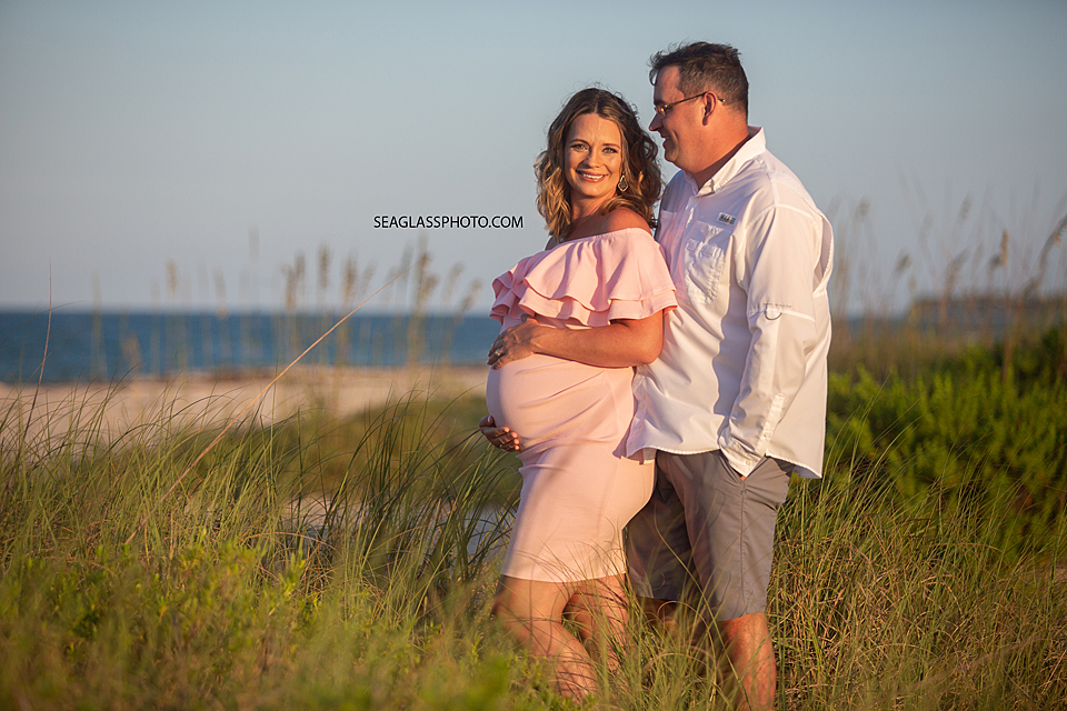Parents to be together on the beach at sunset in Vero Beach Florida