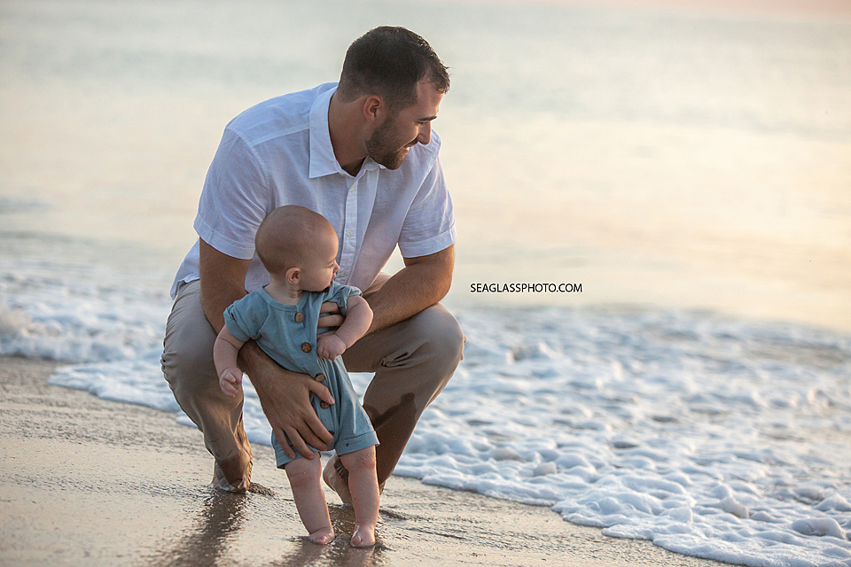 Father and son on the beach at sunrise in Vero Beach Florida