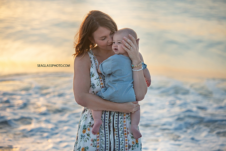 Mother and son on the beach at sunrise in Vero Beach Florida