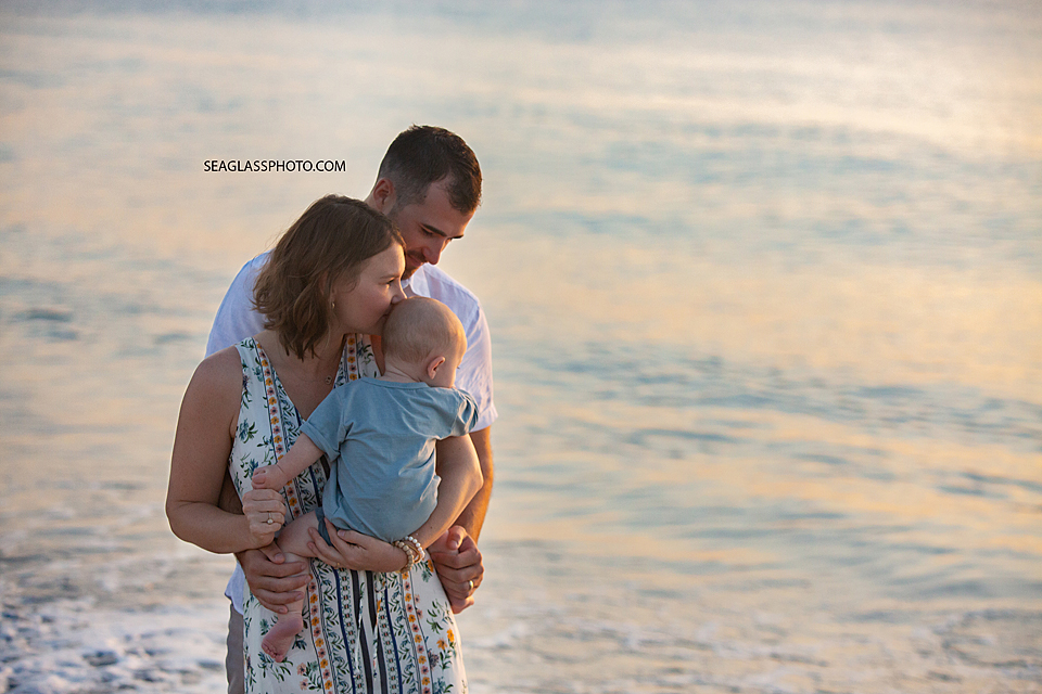 Parents and their son on the beach at sunrise in Vero Beach Florida