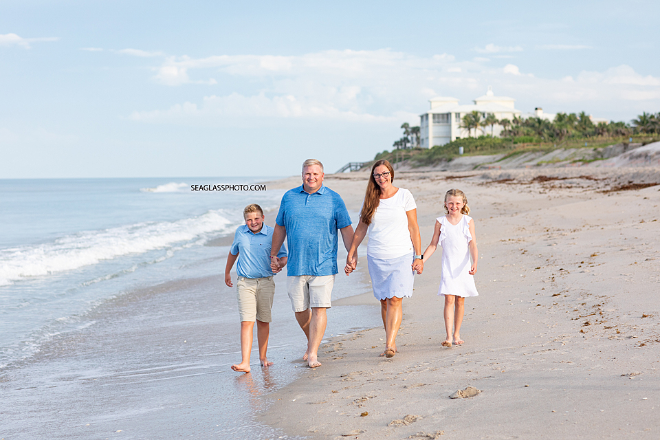 Family walking down the beach in Vero Beach Florida