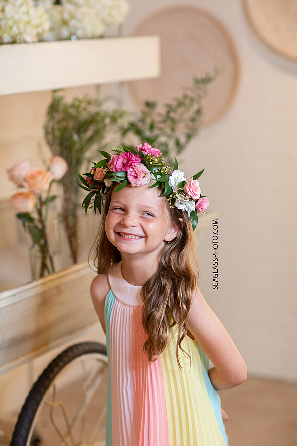 Little girl laughing wearing a flower crown in Vero Beach Florida